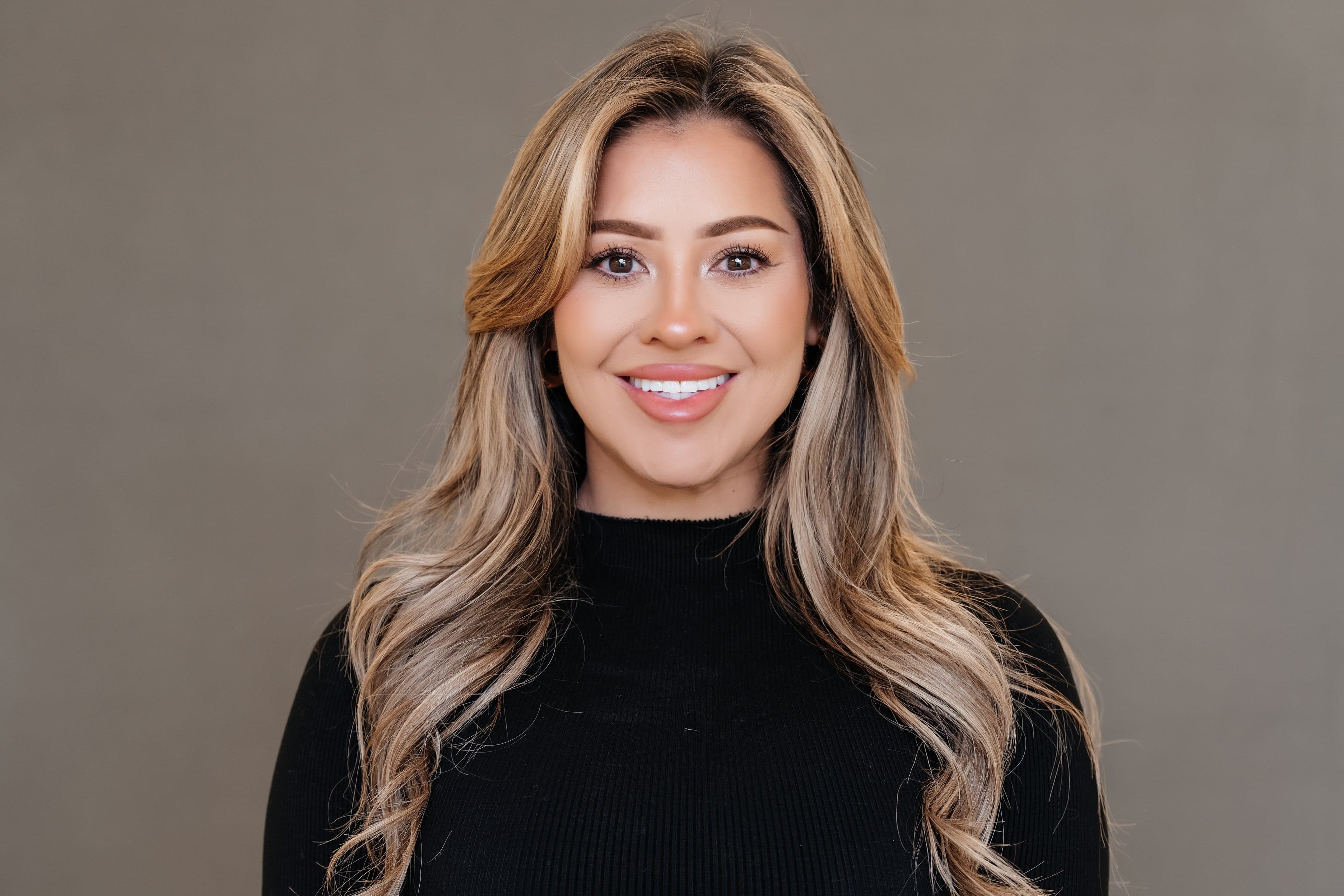 Professional headshot with clean background — executive portrait for leadership pages